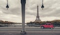 Eiffel Tower, Paris, France and retro red car under the Pont de Bir-Hakeim Bridge Royalty Free Stock Photo