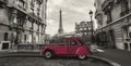 Eiffel Tower in Paris and retro red car at the Avenue de Camoens Royalty Free Stock Photo