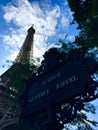 Eiffel tower Paris and street sign Avenue Gustave Eiffel