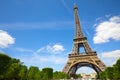 Eiffel Tower in Paris in a summer day, blue sky and green trees Royalty Free Stock Photo