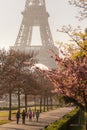 Eiffel Tower with people walking in spring park in Paris, France Royalty Free Stock Photo