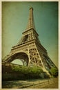 Eiffel tower. Photo in retro style. Paper texture.