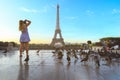 Eiffel tower with pigeons flying around