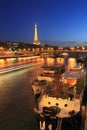 Eiffel Tower and Pont des Invalides at night in Paris, France