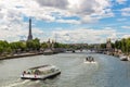 Eiffel tower and river cruise boat on Seine river in Paris, France Royalty Free Stock Photo