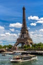Eiffel tower and river cruise boat on Seine river in Paris, France Royalty Free Stock Photo