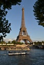 Eiffel Tower and river Seine intense cruise passenger ships traffic. Royalty Free Stock Photo