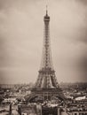 Eiffel tower and rooftops, Paris, France, vintage old photo effect, grainy sepia image Royalty Free Stock Photo