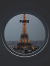 Eiffel Tower seen through a circular window labeled Paris