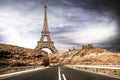 Eiffel tower seen from a desert road Royalty Free Stock Photo
