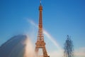 Eiffel Tower seen from fountain making natural rainbow, Paris, France