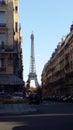 Eiffel Tower seen it by one of Paris` Streets. Charming city