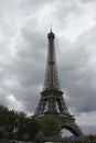 Eiffel Tower set against gray cloudy skies Royalty Free Stock Photo