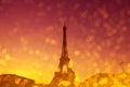 Eiffel Tower silhouette at evening sunset light in Paris France with shiny golden glitter Royalty Free Stock Photo