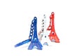 Eiffel tower souvenir keychains in colors of flag of France. Royalty Free Stock Photo