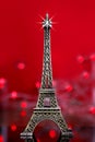 Eiffel tower souvenir in red  lights vertical background Royalty Free Stock Photo