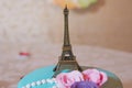 Eiffel tower souvenir toy, isolated on a yellow background Royalty Free Stock Photo