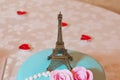 Eiffel tower souvenir toy, isolated on a yellow background Royalty Free Stock Photo