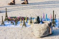 Eiffel tower statuettes for sale in Tuileries garden near Louvre museum and figures of tourists at background Royalty Free Stock Photo