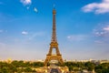 Eiffel tower in summer with flying birds, Paris, France. Scenic panorama of the Eiffel tower under the blue sky. View of the Royalty Free Stock Photo