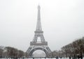 The eiffel tower under falling snow