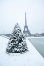 Eiffel tower under the snow in winter in Paris