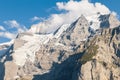 Eiger glacier covered by cumulus clouds in Bernese Alps