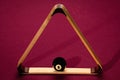 Eight Ball placed within a triangle rack on a pool table Royalty Free Stock Photo