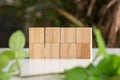 Eight blank wooden block cubes in two rows