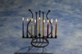 Eight burning Hanukkah candles in Menorah Royalty Free Stock Photo