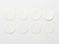 Eight circular white objects arranged in two rows isolated on white background Royalty Free Stock Photo