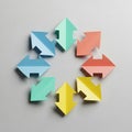 Eight colorful paper arrows arranged in a circular pattern on a light gray background. Royalty Free Stock Photo