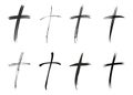 Eight different black christian crosses.