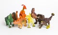 Eight different models of dinosaurs on white
