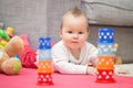 Eight months old baby girl laying on the floor Royalty Free Stock Photo