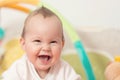 Eight months old baby girl playing with colorful toys Royalty Free Stock Photo