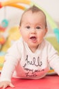 Eight months old baby girl playing with colorful toys Royalty Free Stock Photo