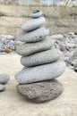 Stone cairn tower, poise stones, rock zen sculpture, light grey pebbles Royalty Free Stock Photo