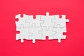 Eight pieces white jigsaw puzzle on red background for business presentation