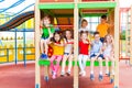 Eight preschoolers sitting together on climbing frame Royalty Free Stock Photo