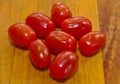 Eight red mini cherry tomatoes