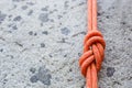 Eight rope knot on rocky background Royalty Free Stock Photo