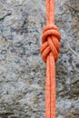 Eight rope knot on rocky background Royalty Free Stock Photo