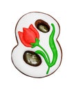 Eight-shaped gingerbread with red tulip and caramel