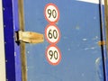 Eight speed restriction sign on red corrugated background