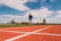 Eight-year-old athlete runs through the sports stadium