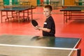 An eight-year-old child plays table tennis Royalty Free Stock Photo