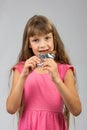 Eight-year-old girl eats chocolate bar