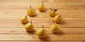 Eight yellow garden ripe pears in the circle