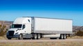 Eighteen wheel big rig tractor with trailer on highway. Trucking industry Royalty Free Stock Photo